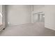 Expansive, carpeted living room with high ceilings and an open layout, leading to the dining area at 5276 S Danube St, Centennial, CO 80015