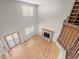 Top-down view of a bright living room with a cozy fireplace and hardwood floors at 5276 S Danube St, Centennial, CO 80015
