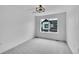 Bright bedroom with a large window offering natural light and views of the outdoors at 8530 W 52Nd Ave # A1, Arvada, CO 80002