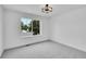 Bright bedroom with a large window offering natural light and views of the outdoors at 8530 W 52Nd Ave # A1, Arvada, CO 80002