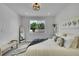 Bright bedroom with soft carpeting, a large window, and tasteful décor creating a relaxing atmosphere at 8530 W 52Nd Ave # A1, Arvada, CO 80002