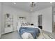 Cozy bedroom features a comfortable bed, stylish decor, and a large window for natural light at 8530 W 52Nd Ave # A1, Arvada, CO 80002