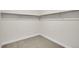 Empty walk-in closet with carpet flooring and metal shelving ready for organization at 8530 W 52Nd Ave # A1, Arvada, CO 80002