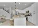 Spacious kitchen features a large island, pendant lighting, and stainless steel appliances at 8530 W 52Nd Ave # A1, Arvada, CO 80002