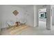 Cozy sitting room with comfortable chairs, decorative rug, and open doorway at 8530 W 52Nd Ave # A1, Arvada, CO 80002