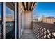 Balcony features wood decking and lattice railing with views of the community and blue skies at 12360 W Nevada Pl # 206, Lakewood, CO 80228