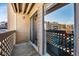 Private balcony area with sliding glass door and decorative railings, offering views of the community at 12360 W Nevada Pl # 206, Lakewood, CO 80228