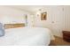 Well-lit bedroom offering soft carpeting, a decorative wall sconce, and convenient access at 12360 W Nevada Pl # 206, Lakewood, CO 80228