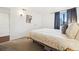 Comfortable bedroom with soft, neutral carpet, ample natural light, and simple elegant touches at 12360 W Nevada Pl # 206, Lakewood, CO 80228