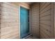 A charming blue front door welcomes you with a cheerful 'welcome' mat and a secure entry system at 12360 W Nevada Pl # 206, Lakewood, CO 80228