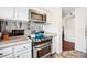 Well-equipped kitchen featuring stainless steel appliances, granite countertops, and lots of cabinet space at 12360 W Nevada Pl # 206, Lakewood, CO 80228