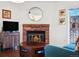Bright living room with fireplace, access to the balcony, and dining space, great for relaxing and entertaining at 12360 W Nevada Pl # 206, Lakewood, CO 80228
