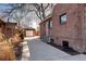 Long driveway to a detached garage with a side yard at 1378 Forest St, Denver, CO 80220