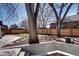 Backyard showcasing mature trees and updated landscaping at 1378 Forest St, Denver, CO 80220