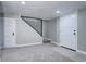 Finished basement with neutral carpet, clean white walls, and two entryways, ideal for extra living space at 1378 Forest St, Denver, CO 80220