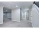 Spacious finished basement with carpet, lighting, and access to other rooms at 1378 Forest St, Denver, CO 80220