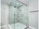 Modern glass enclosed shower with tiled walls and shower niche at 1378 Forest St, Denver, CO 80220