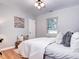 Cozy bedroom with natural light, hardwood floors, and comfortable furnishings at 1378 Forest St, Denver, CO 80220