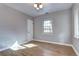 Bright bedroom featuring hardwood floors, neutral walls and a window with natural light at 1378 Forest St, Denver, CO 80220