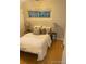 Comfortable bedroom with a soft bed, pillows, and natural light through the window at 1378 Forest St, Denver, CO 80220