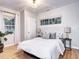Serene bedroom with hardwood floors, natural light, and neutral décor at 1378 Forest St, Denver, CO 80220