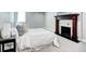Bedroom with fireplace and neutral paint and carpet at 1378 Forest St, Denver, CO 80220