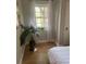 Well-lit bedroom with a potted plant near a window providing natural light at 1378 Forest St, Denver, CO 80220