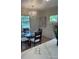Elegant dining area with a chandelier, windows, and hardwood floors at 1378 Forest St, Denver, CO 80220