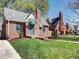Charming brick home with a manicured lawn, blue front door, and a welcoming walkway enhancing its curb appeal at 1378 Forest St, Denver, CO 80220