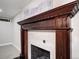 Ornate fireplace featuring wood trim and a decorative brick surround at 1378 Forest St, Denver, CO 80220