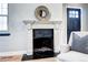 Close-up of a decorative fireplace with tiled hearth and detailed mantel, adding charm to the living space at 1378 Forest St, Denver, CO 80220