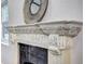 Close-up of the fireplace mantel with decorative accents and classic design at 1378 Forest St, Denver, CO 80220