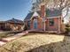 A single-story red brick home features a gabled roof, chimney, and manicured front yard in a residential neighborhood at 1378 Forest St, Denver, CO 80220