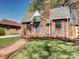 Charming brick home with a well-maintained lawn and inviting entryway, creating a warm curb appeal at 1378 Forest St, Denver, CO 80220