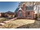 Quaint brick home featuring a chimney and gabled roof, complemented by a well-manicured lawn at 1378 Forest St, Denver, CO 80220