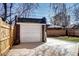Detached garage with paved driveway in backyard at 1378 Forest St, Denver, CO 80220