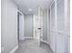 Hallway with closet and doorways in neutral paint and gray carpet at 1378 Forest St, Denver, CO 80220