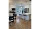 Modern kitchen with white cabinets, stainless steel appliances, and a breakfast bar at 1378 Forest St, Denver, CO 80220