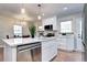 Bright kitchen with a stainless steel dishwasher and fixtures, light countertops and hardwood floors at 1378 Forest St, Denver, CO 80220