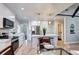 Open concept kitchen with island, stainless steel appliances, and modern finishes at 1378 Forest St, Denver, CO 80220