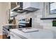 Modern kitchen with stainless steel appliances, bright countertops, and ample cabinet space for cooking at 1378 Forest St, Denver, CO 80220