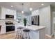Stylish kitchen with white cabinets, stainless steel appliances, and a center island at 1378 Forest St, Denver, CO 80220