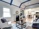 Open-concept living area with fireplace, dining area, and kitchen at 1378 Forest St, Denver, CO 80220