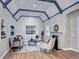Bright living room with vaulted ceilings, exposed beams, fireplace, and hardwood floors at 1378 Forest St, Denver, CO 80220