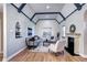 Elegant living room with hardwood floors, fireplace, and beamed ceilings, offering a cozy and stylish space at 1378 Forest St, Denver, CO 80220