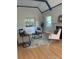 Comfortable living room featuring hardwood floors, bright windows, and a fireplace at 1378 Forest St, Denver, CO 80220