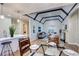 Living room featuring vaulted ceilings, dark trim, hardwood floors, and an open floor plan at 1378 Forest St, Denver, CO 80220