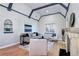 Living room with a fireplace, hardwood floors, and eye catching ceiling beams at 1378 Forest St, Denver, CO 80220