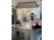 Open-concept living area with hardwood floors and a view of the modern kitchen at 1378 Forest St, Denver, CO 80220
