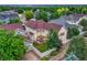 Aerial view of the house showcasing the backyard, patio, fence, and surrounding neighborhood at 13053 Umatilla Ct, Denver, CO 80234